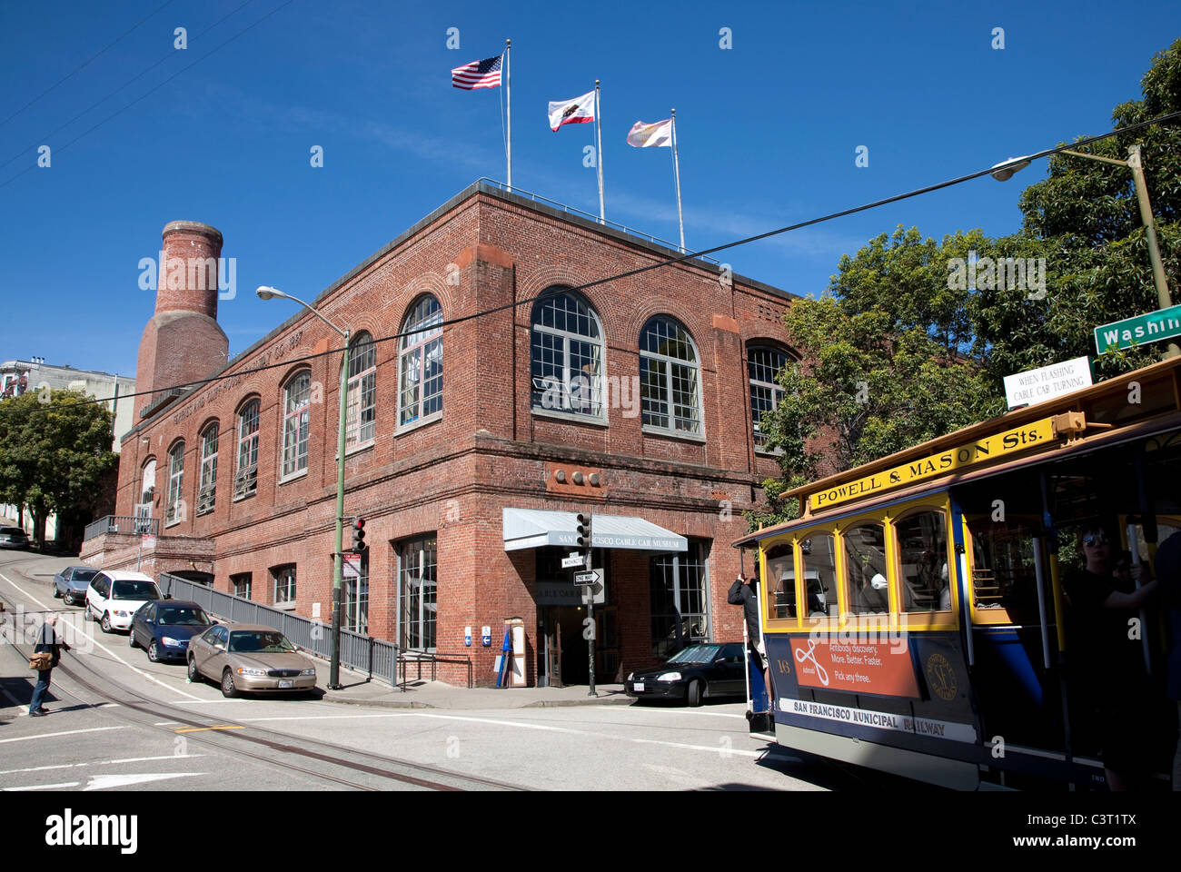 Cable car passing the Cable Car Museum with powerhouse and car barn, Washington and Mason Streets, Nob Hill, San Francisco Stock Photo