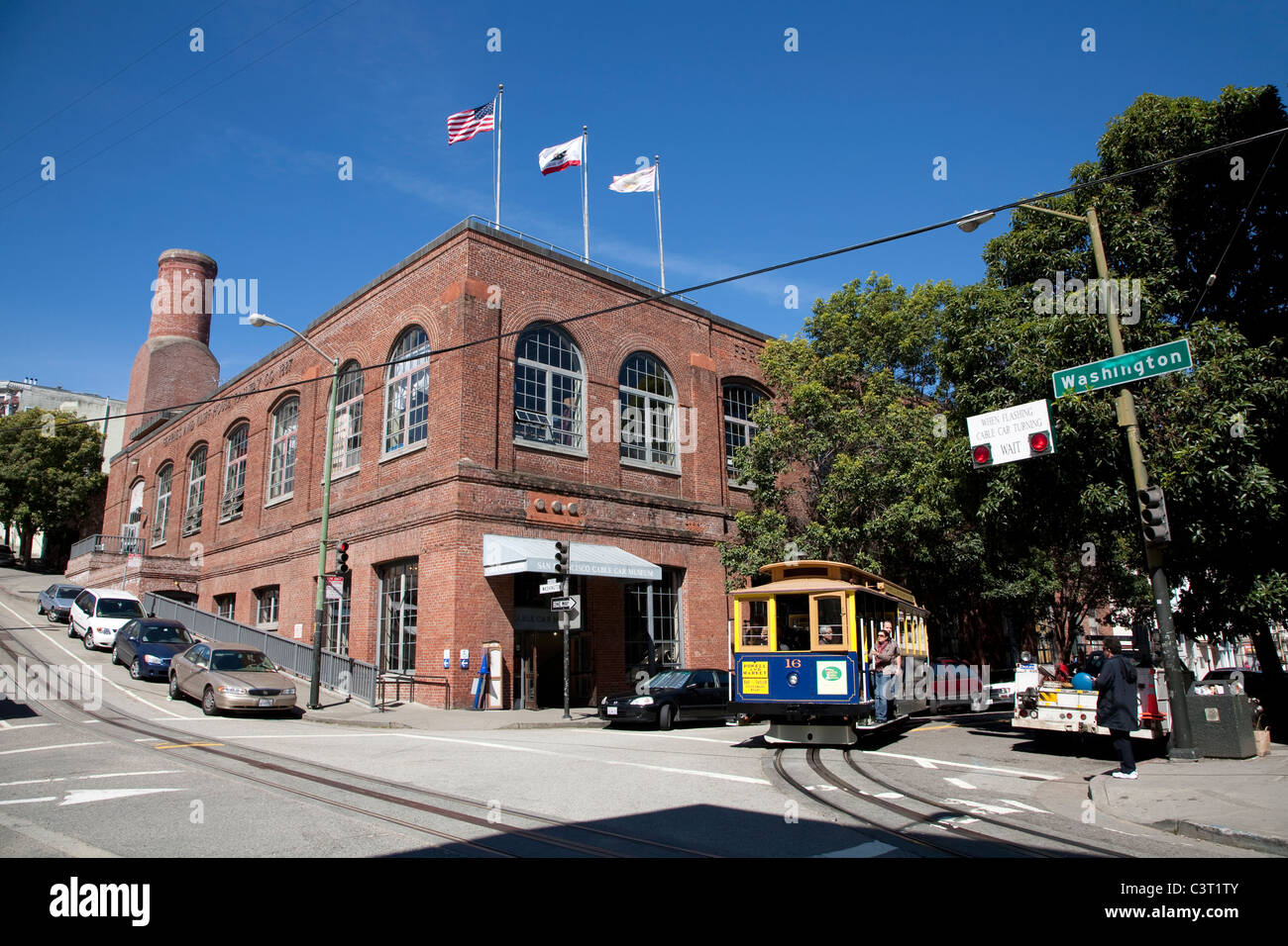 Cable car passing the Cable Car Museum with powerhouse and car barn, Washington and Mason Streets, Nob Hill, San Francisco Stock Photo