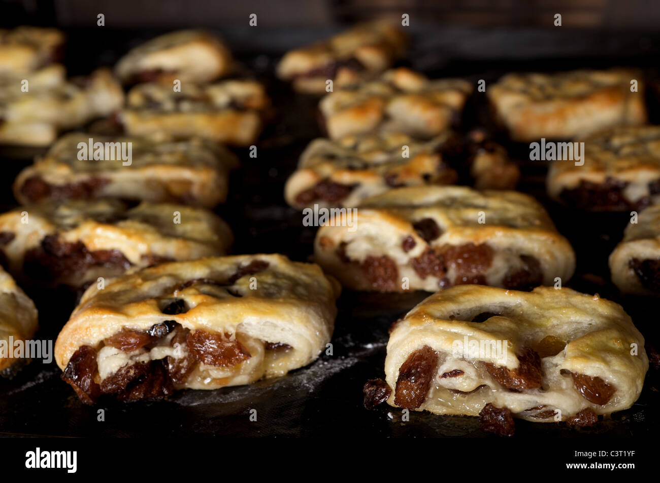 Homemade Wiltshire Lardy cakes being baked in oven Stock Photo Alamy