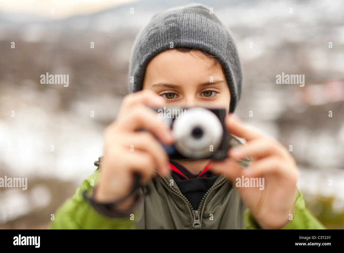 Boy with a digital camera taking pictures outdoor Stock Photo - Alamy