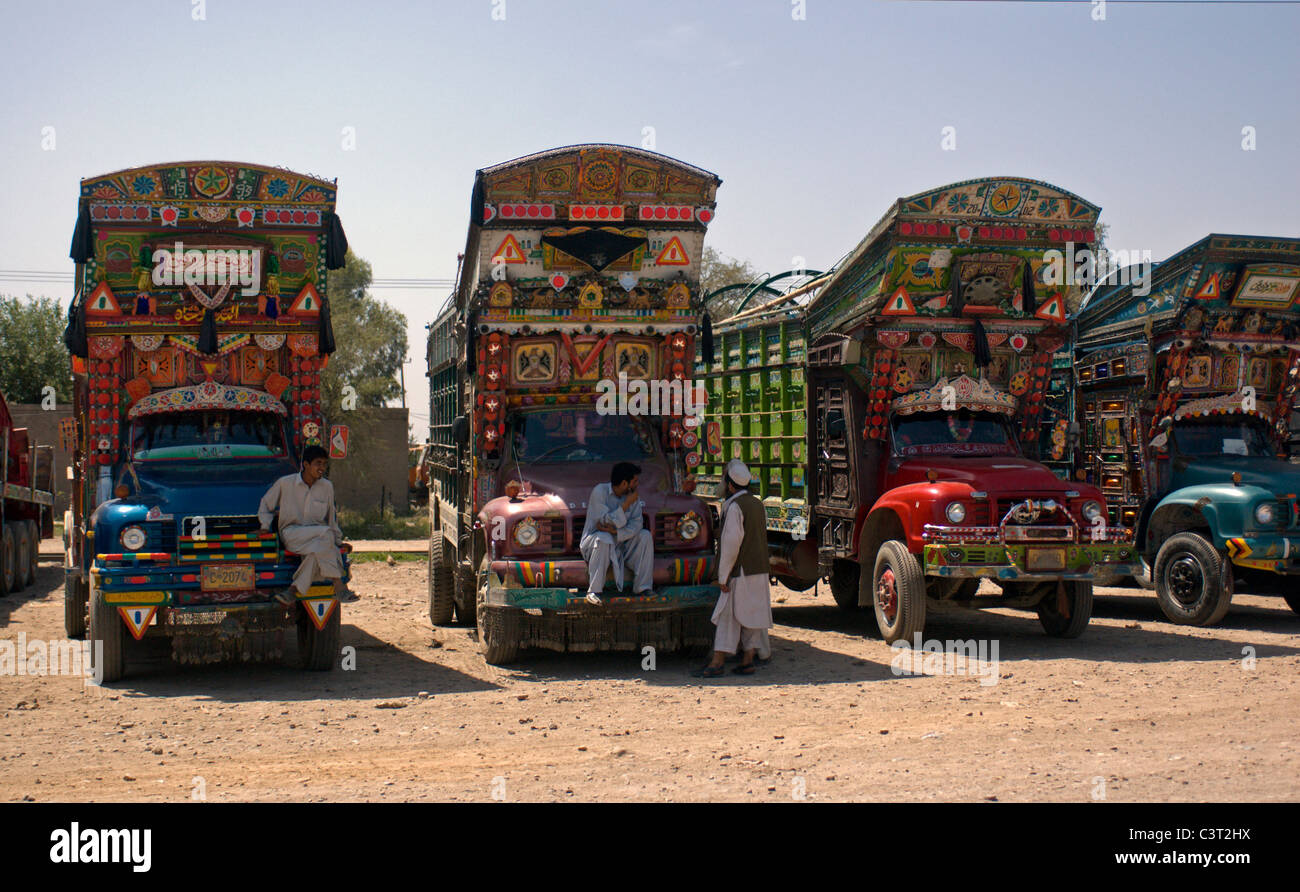 Men sit on their trucks. Stock Photo