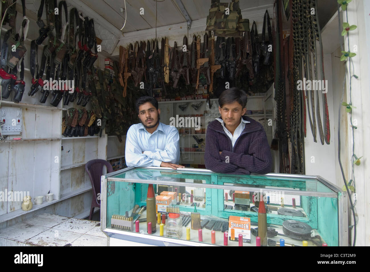 Two men at a gun store. Stock Photo