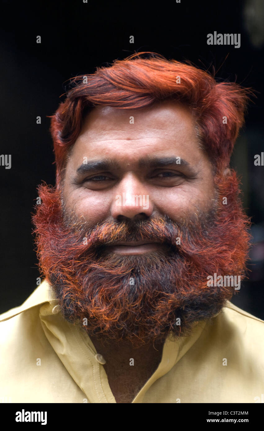 A man with red dyed hair and beard in the Old City. Stock Photo