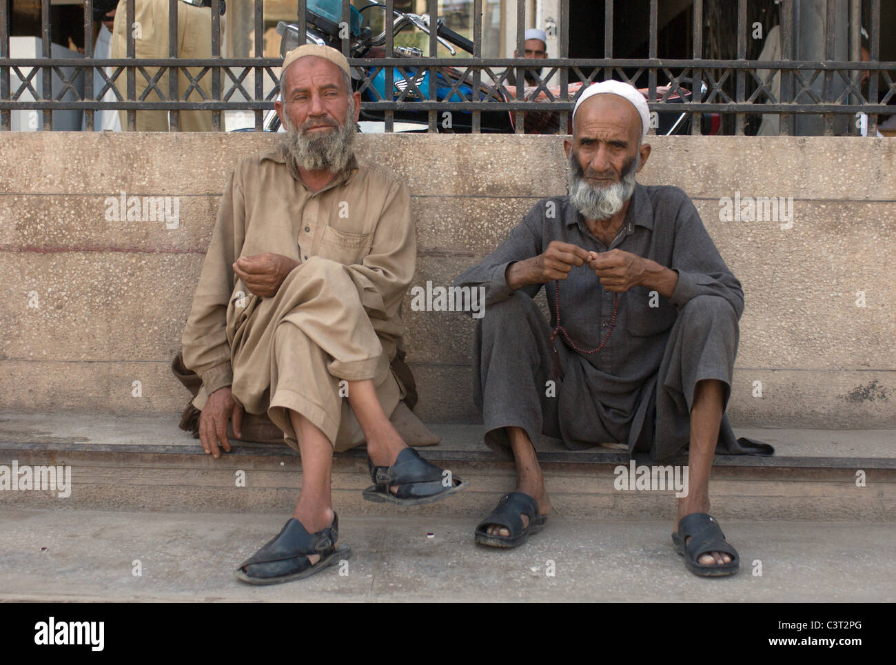 Two men sit in the Old City. Stock Photo