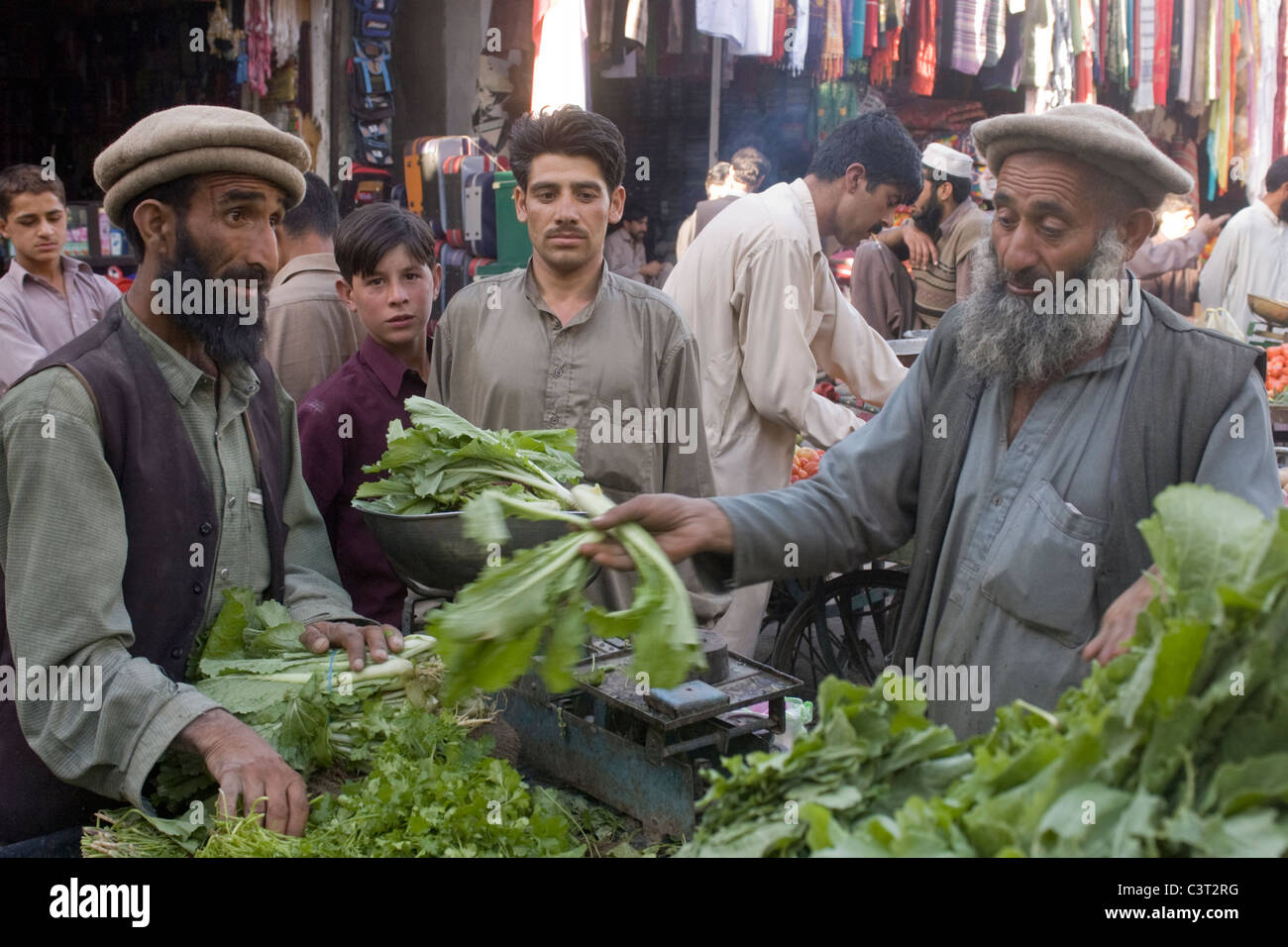 A man sells produce at Kashmiri Bazaar. Stock Photo
