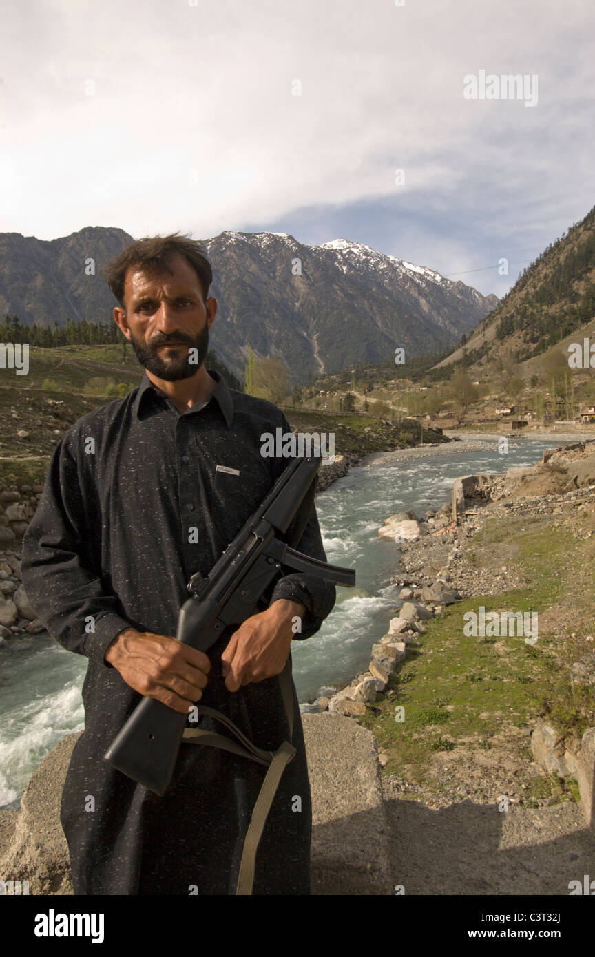A policeman stands for a photo east of Kalam. Stock Photo