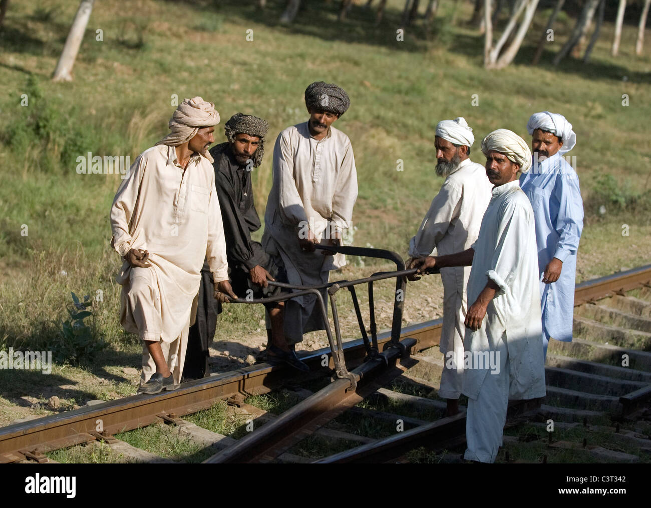 Men work on the railroad near Gujrat. Stock Photo