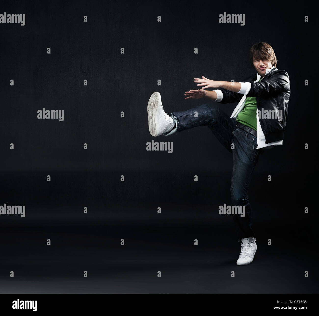 Handsome hip hop dancer jumping Stock Photo