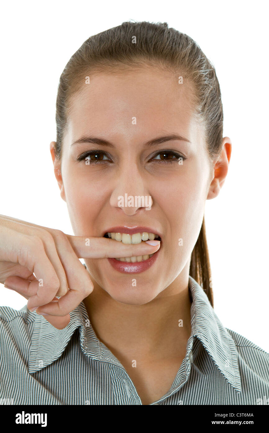 Woman biting her finger Stock Photo