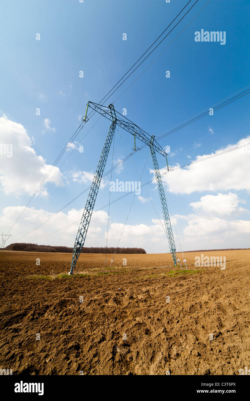 Landscape with big power lines against the blue sky Stock Photo - Alamy