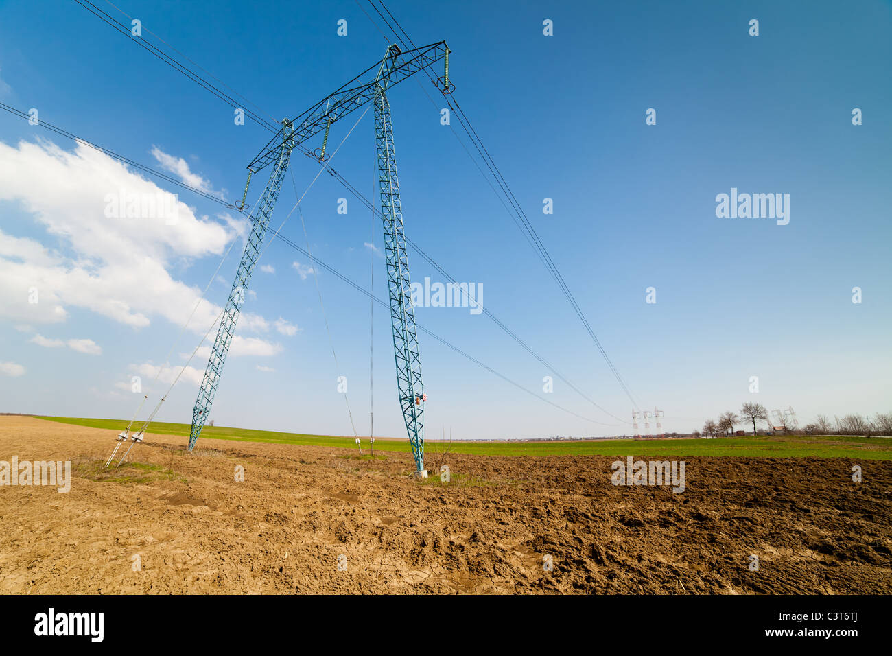Landscape with big power lines against the blue sky Stock Photo - Alamy