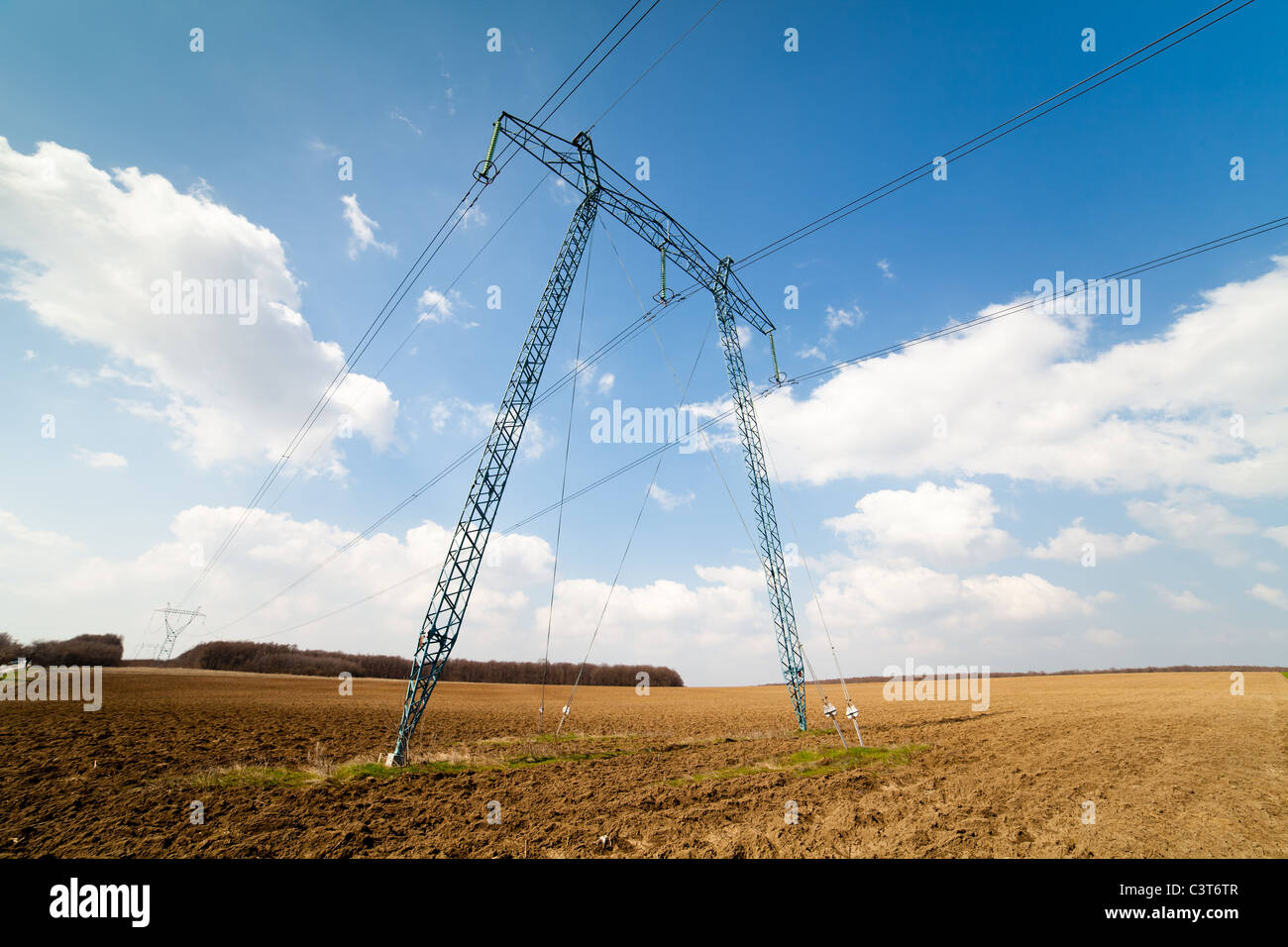 Landscape with big power lines against the blue sky Stock Photo - Alamy