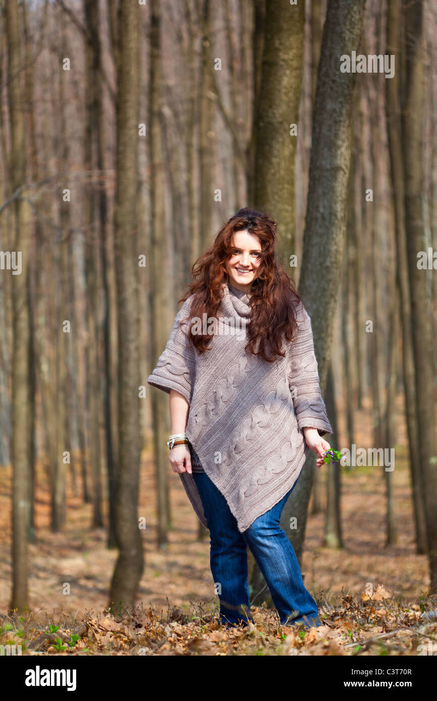 Young woman taking a walk in a beech forest Stock Photo - Alamy