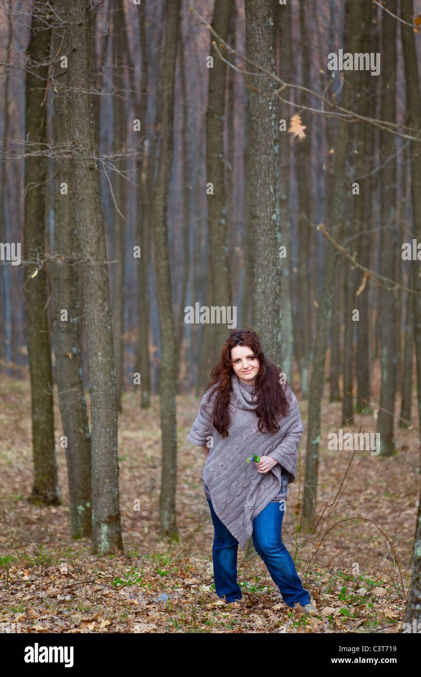 Young woman taking a walk in a beech forest Stock Photo - Alamy