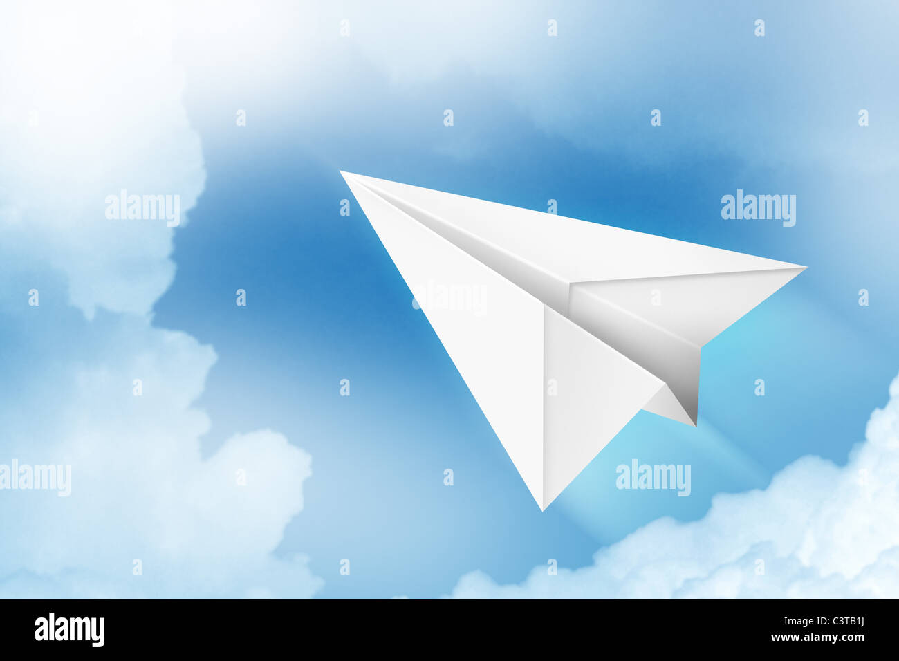 Paper plane flying through the air Stock Photo - Alamy