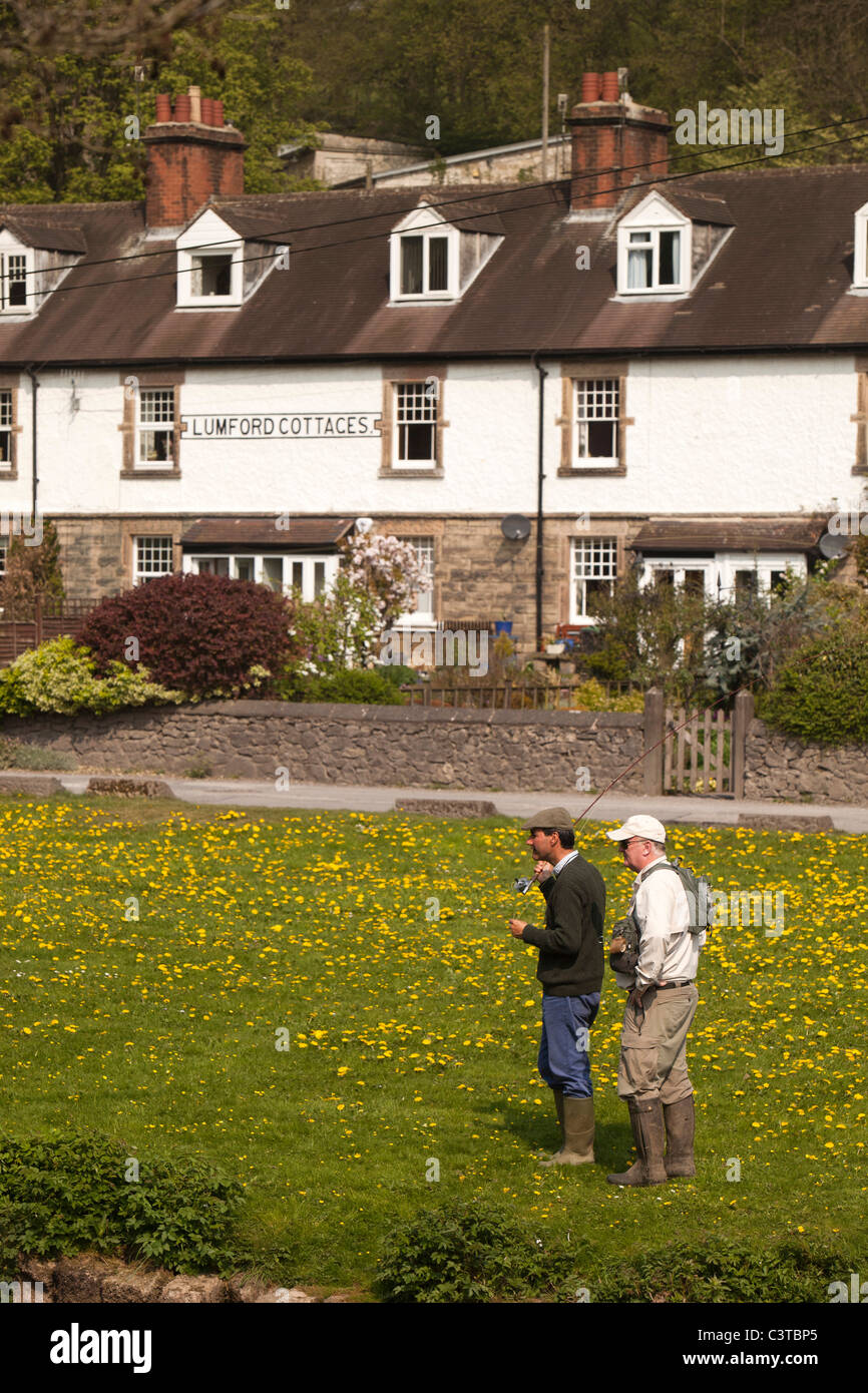 UK, Derbyshire, Peak District, Bakewell, man having fly fishing lesson