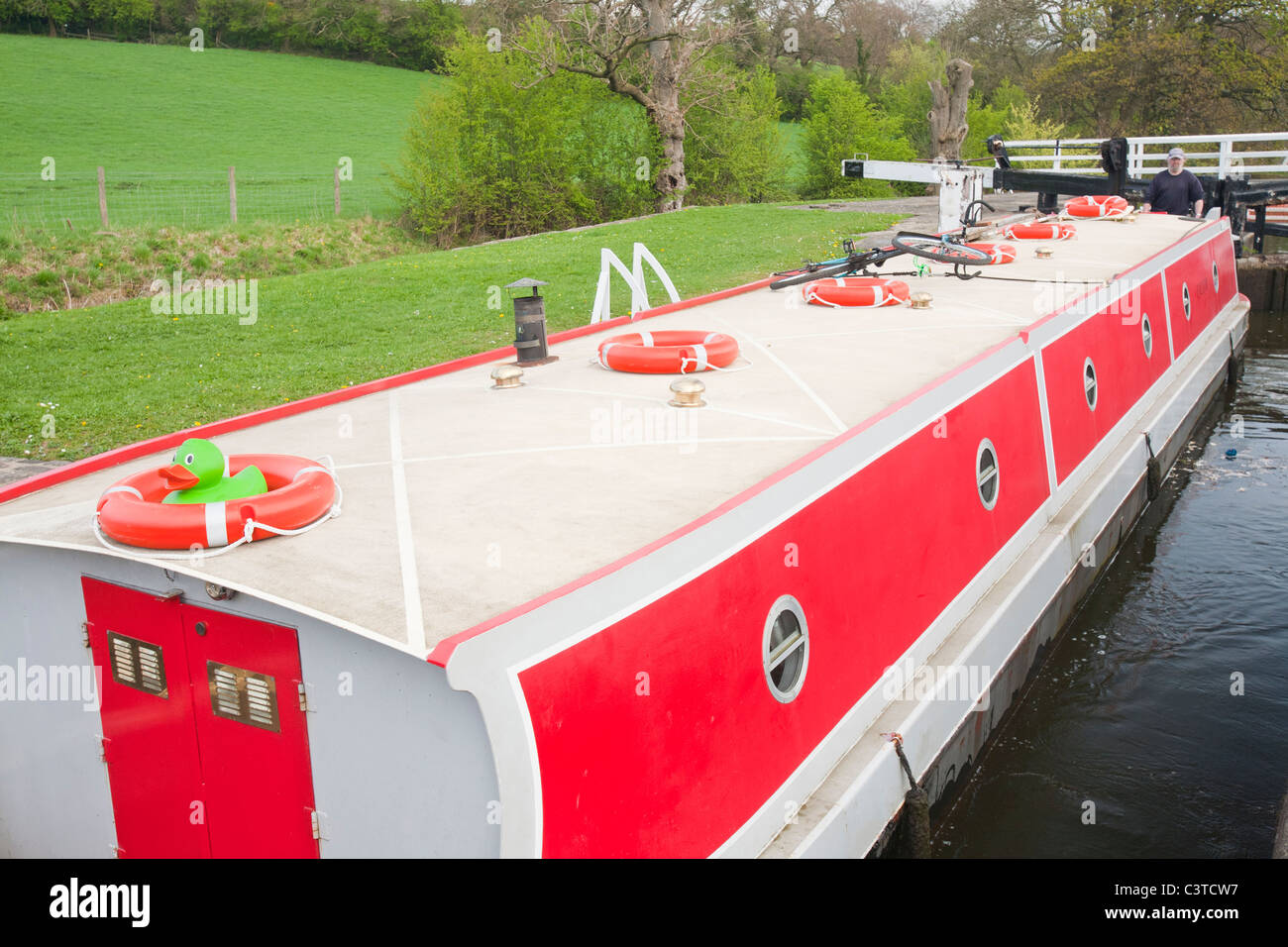 A narrow boat in locks on the Leeds Liverpool canal near Saltaire in