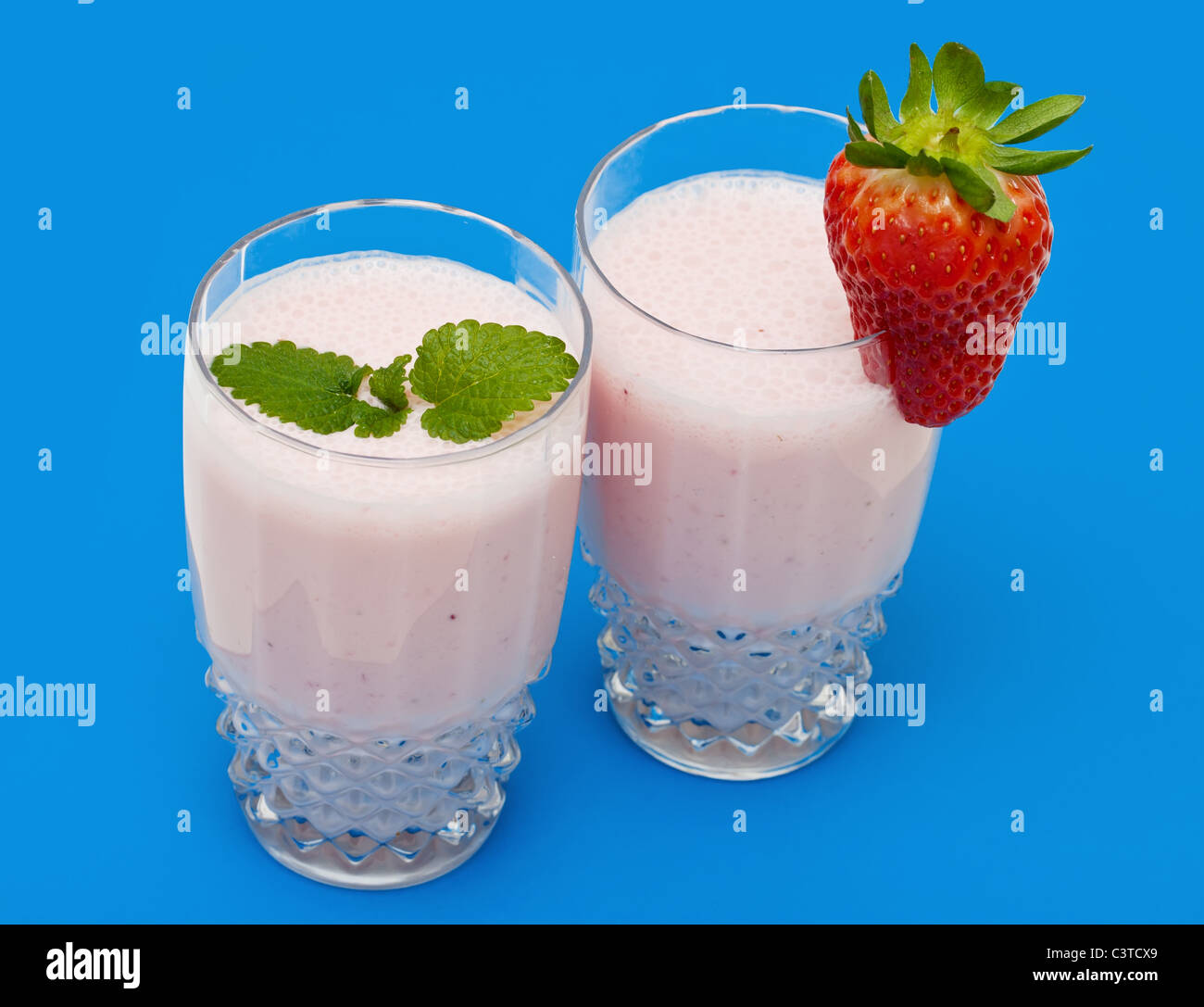 Strawberry milkshake on a blue background Stock Photo