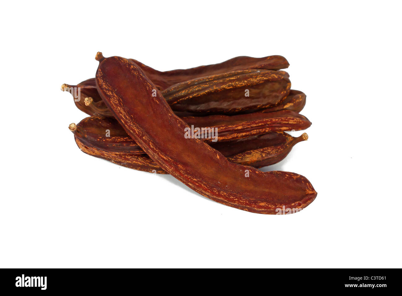 Bunch of dried carob isolated on white Stock Photo