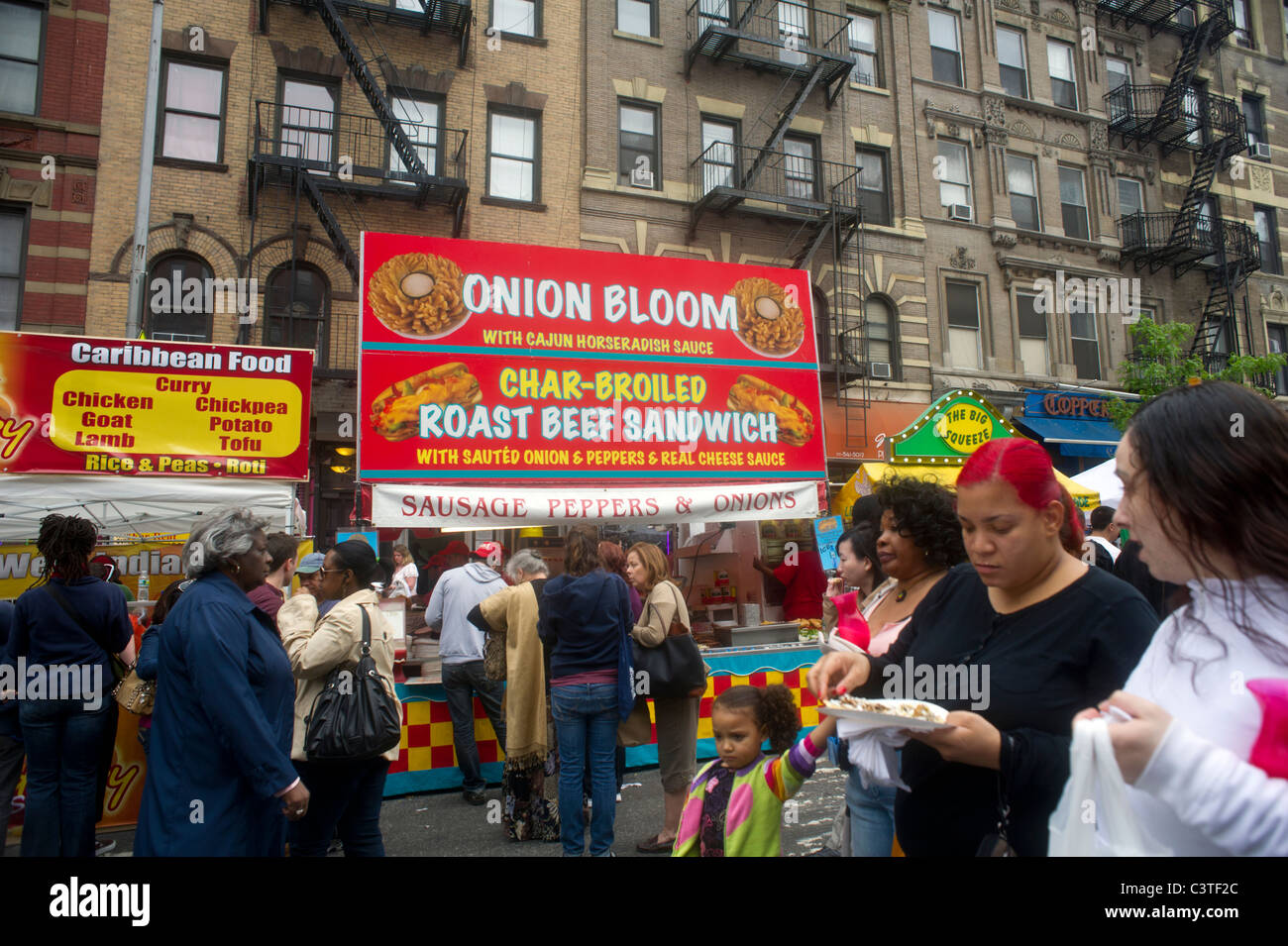 Stands selling ethnic food at the Ninth Avenue Food Festival in New York seen on Saturday, May 14, 2011. (© Frances M. Roberts) Stock Photo