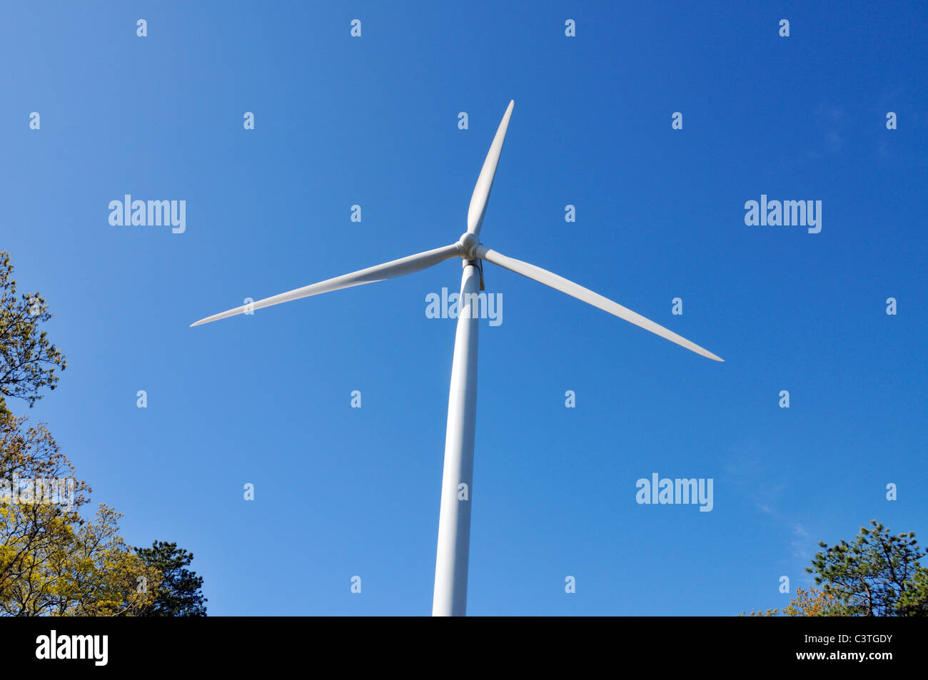 Looking up to a single wind turbine on a sunny blue sky day. USA Stock Photo