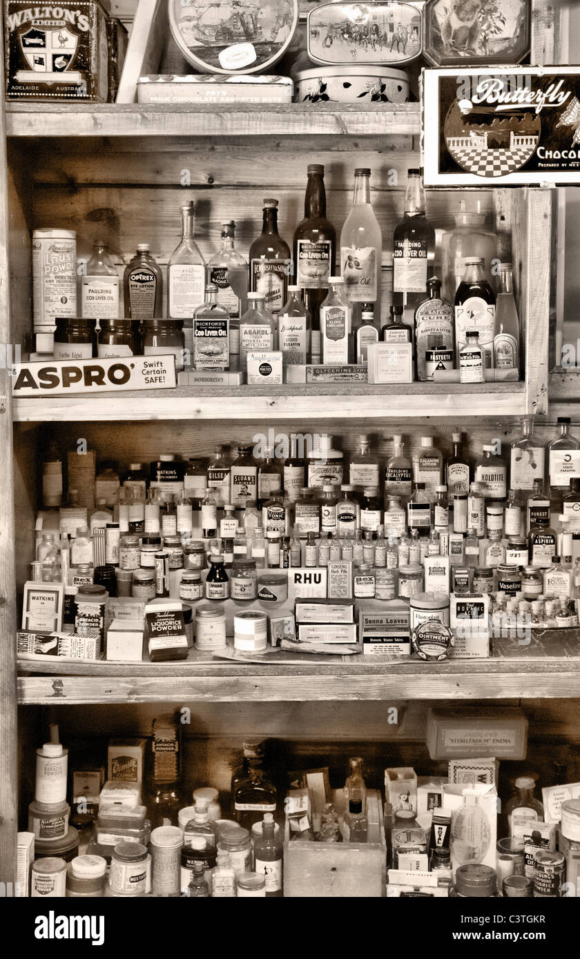 Old medicine bottles in an old pharmacy or general store Stock Photo