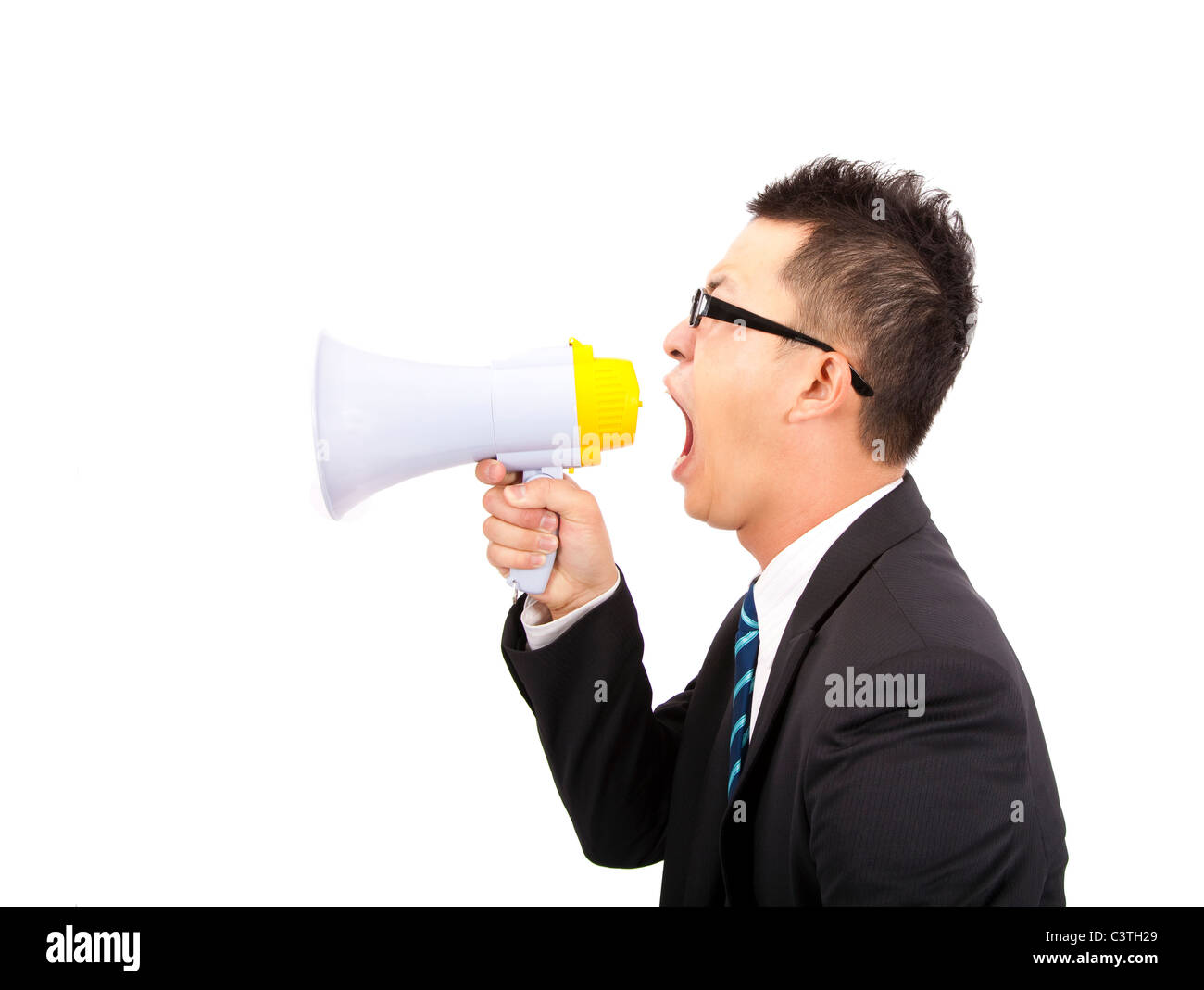 young Businessman make loud noise by megaphone Stock Photo