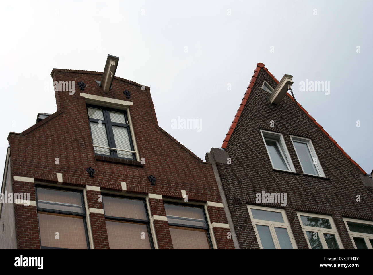 Upper parts of two houses in Amsterdam, with the traditional furniture