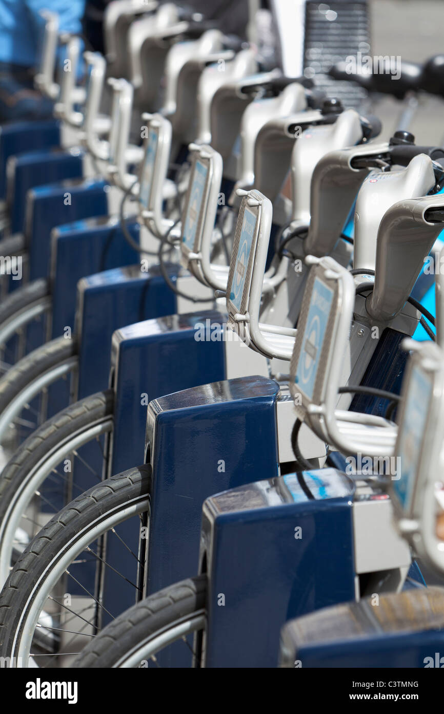 boris bikes, cycles for hire rental in docking bay,London, England Stock Photo