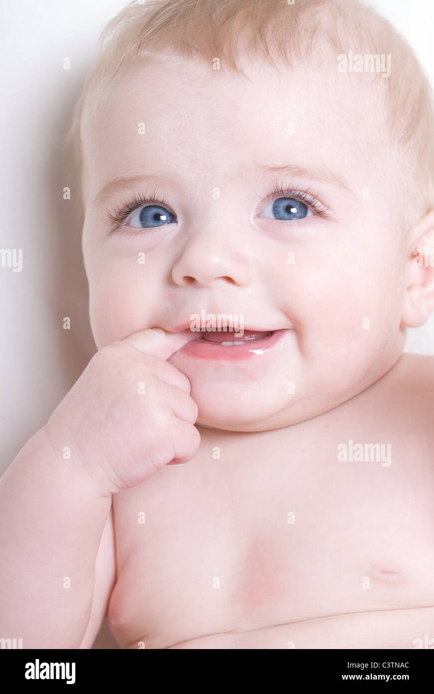 baby, 6 months, smiling, blue eyes Stock Photo