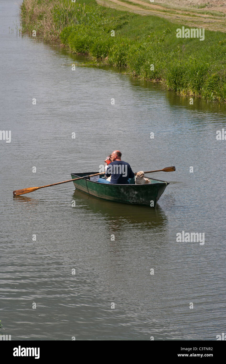 Father and Daughter With A Dog In A Rowing Boat Stock Photo