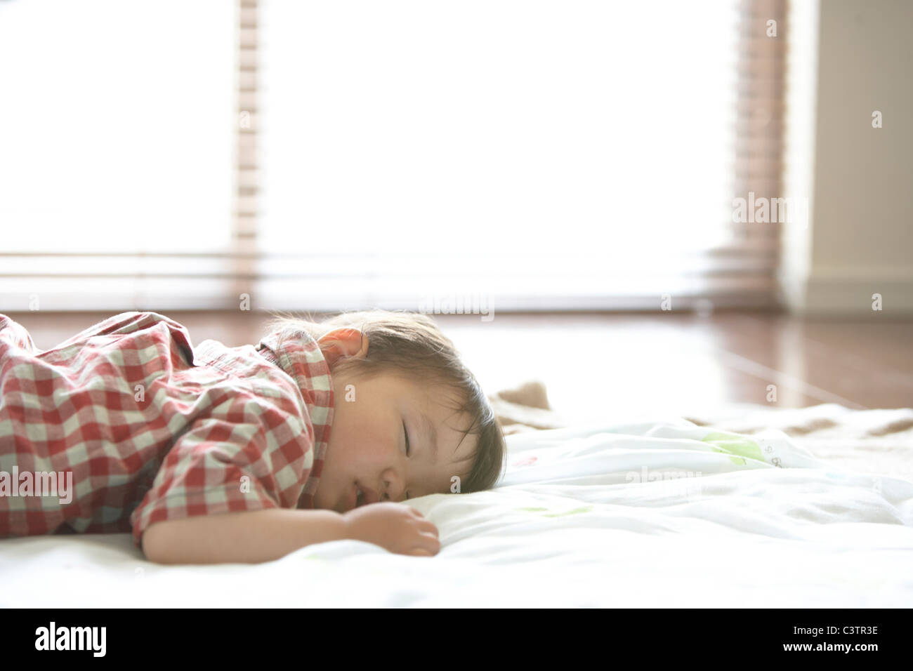 Baby Boy Sleeping on Floor Stock Photo Alamy