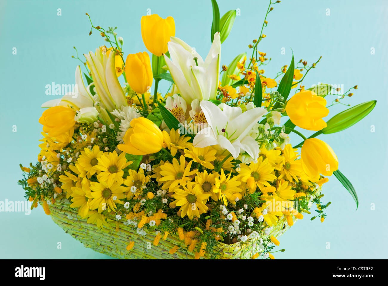 Basket of Yellow Flowers Stock Photo Alamy