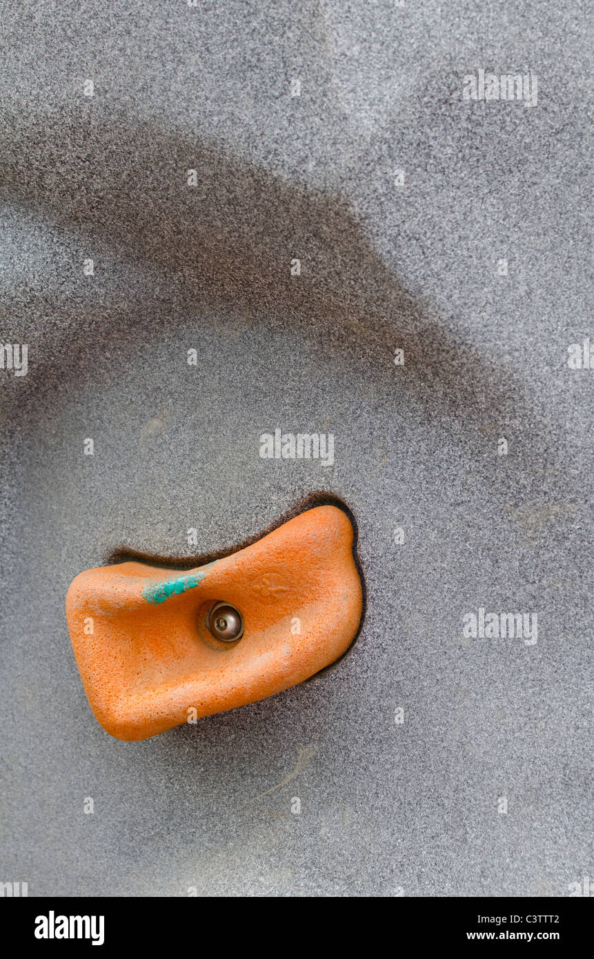 Hand grip on climbing wall Stock Photo - Alamy