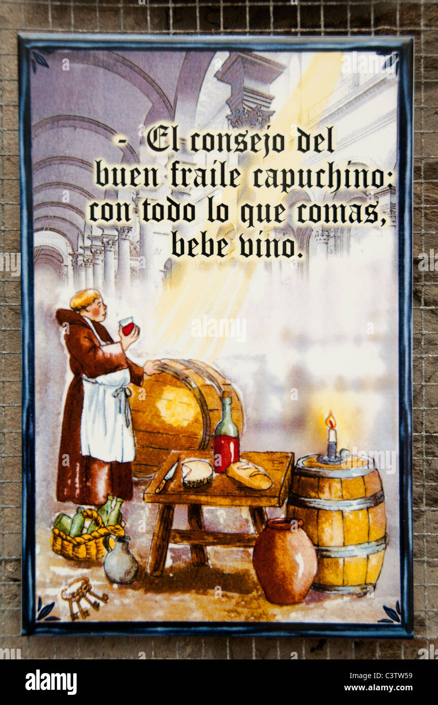 El consej del buen fraile capuchino con todo lo que comas bebe vino The Capuchin good advice with everything you eat drink wine Stock Photo