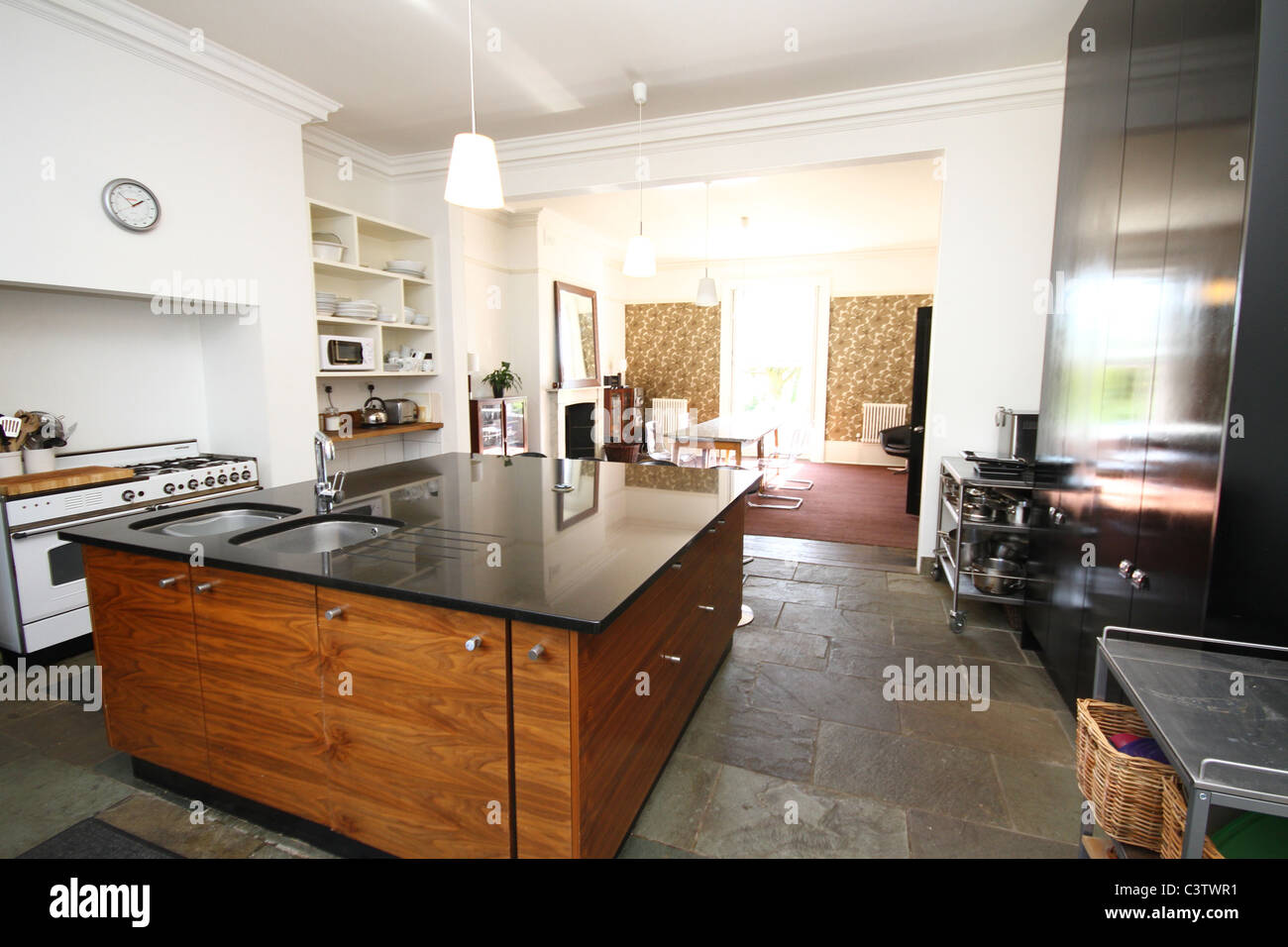 Large kitchen, center island, granite worktops Stock Photo Alamy