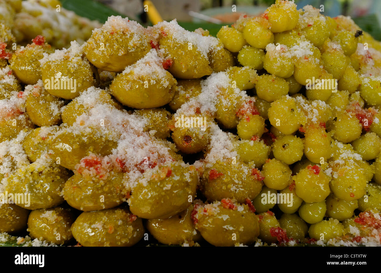fermented Elaeocarpus hygrophilus Kurz and gooseberries,chinese thai delicacy and sweet dessert, bangkok, thailand Stock Photo