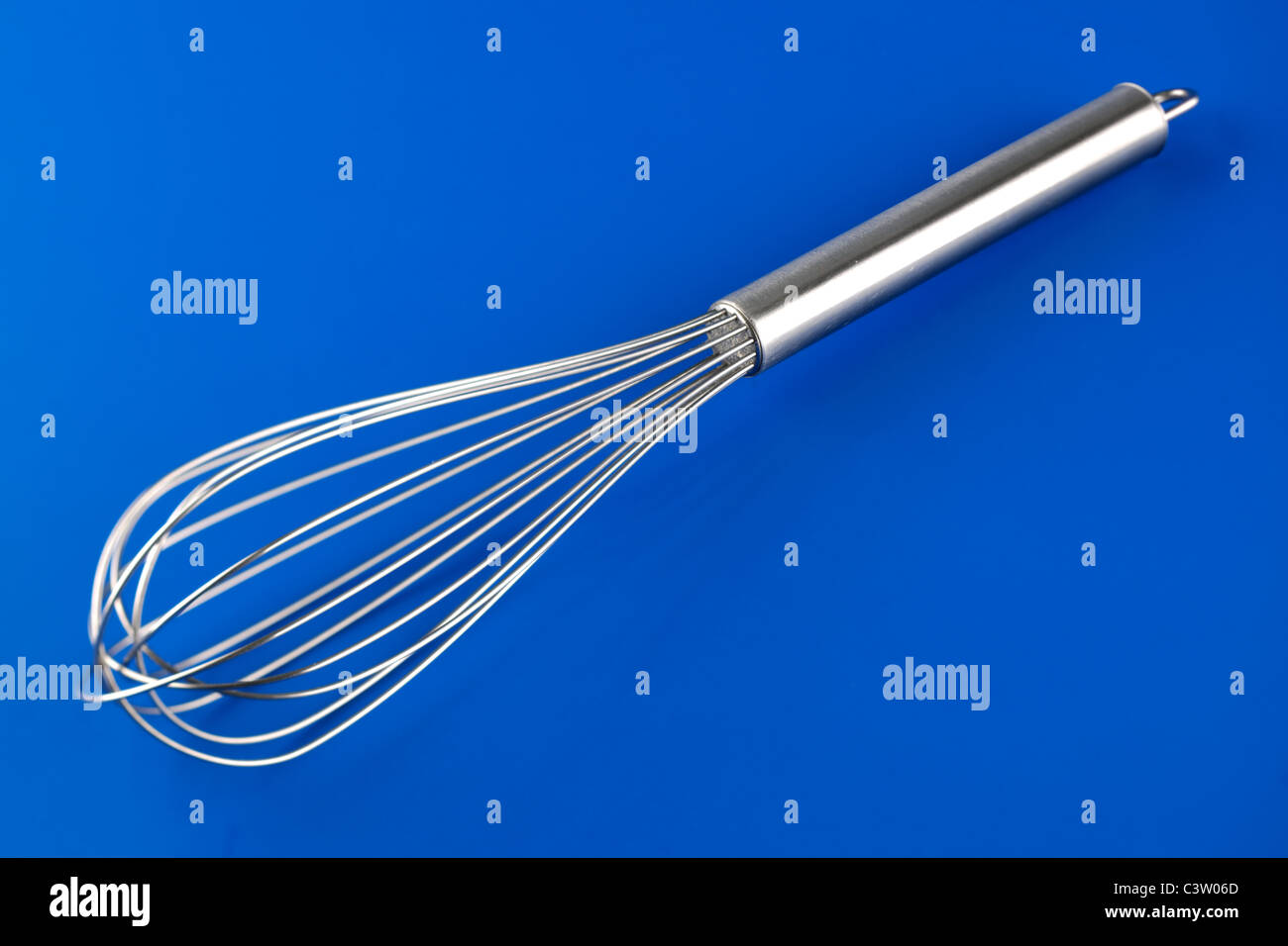Stainless steel egg whisk Stock Photo Alamy