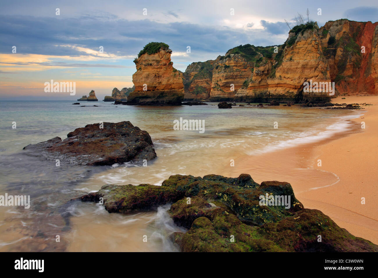 Soft morning light on the fascinating rock formations at Praia Dona Ana near Lagos in the Algarve Region of Portugal Stock Photo