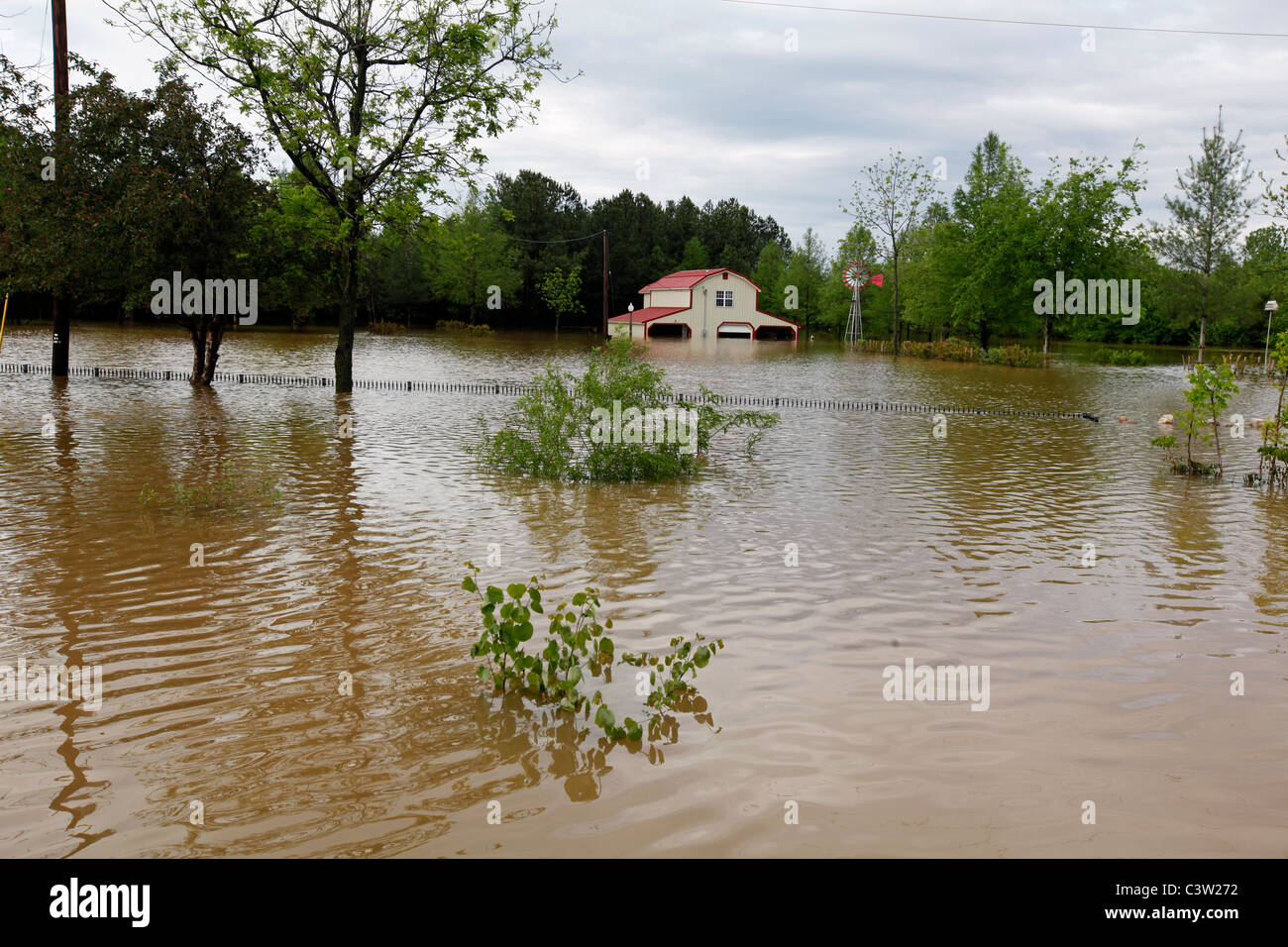 A home off of Highway B sits in flooded water in Poplar Bluff