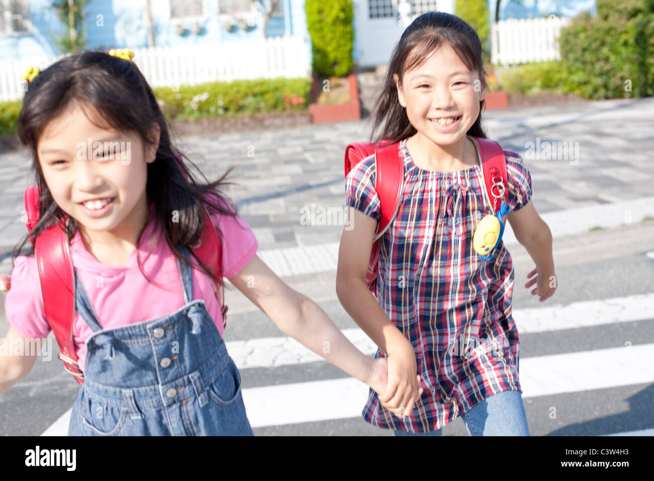 Schoolgirls crossing street, Japan Stock Photo - Alamy