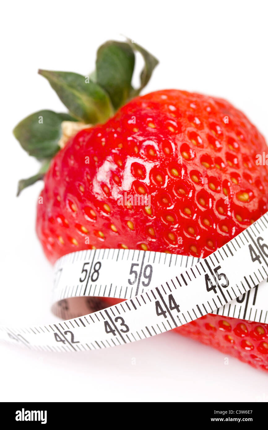 Strawberry with measure tape, closeup on white Stock Photo - Alamy
