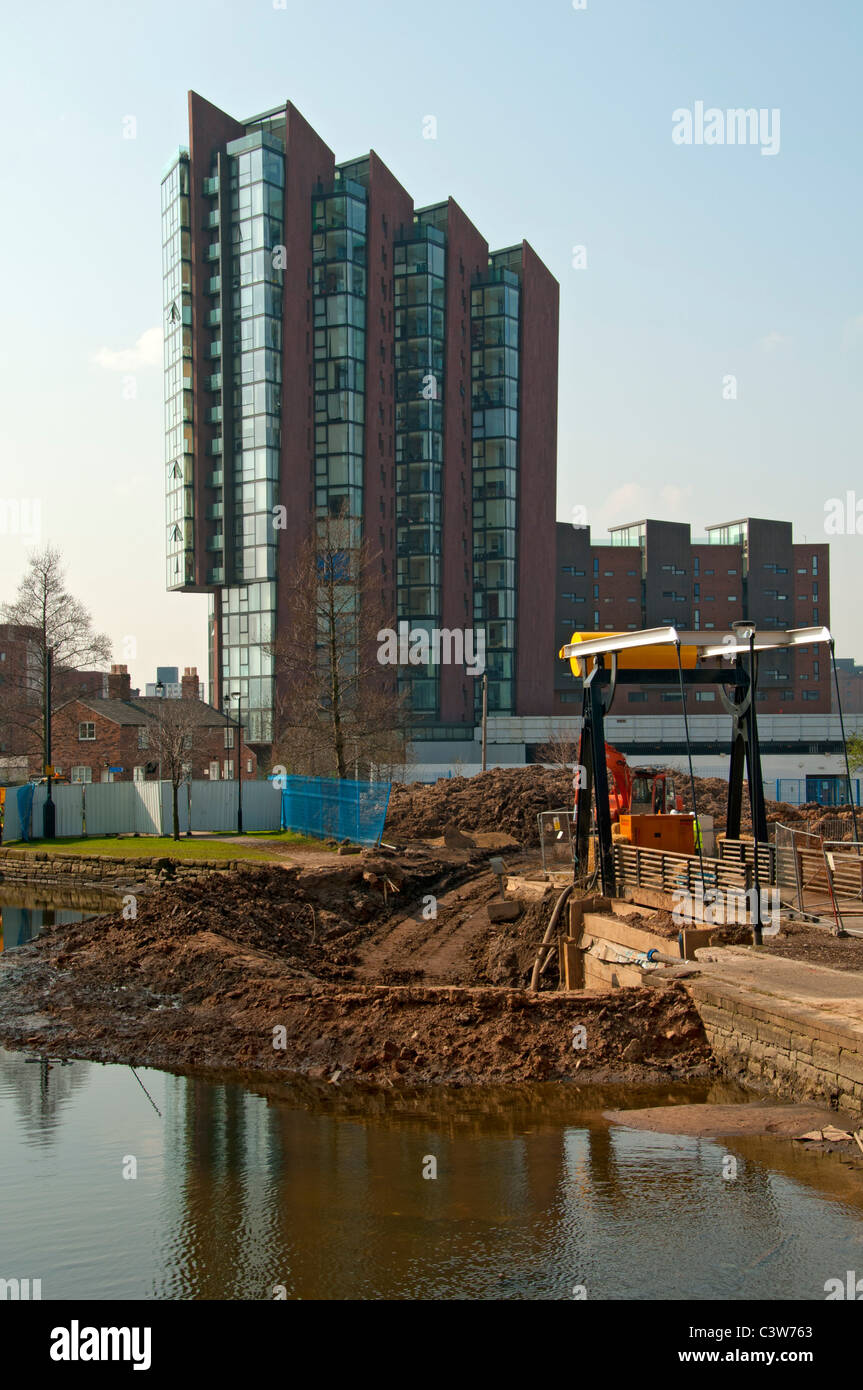 The Islington Wharf apartment block from the Ashton Canal, New Islington, Ancoats, Manchester, England, UK Stock Photo