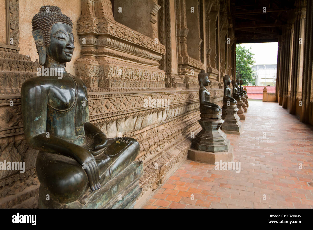 old buddha bronze and jade statue in hall, haw pha kaew, Vientiane, Lao Stock Photo