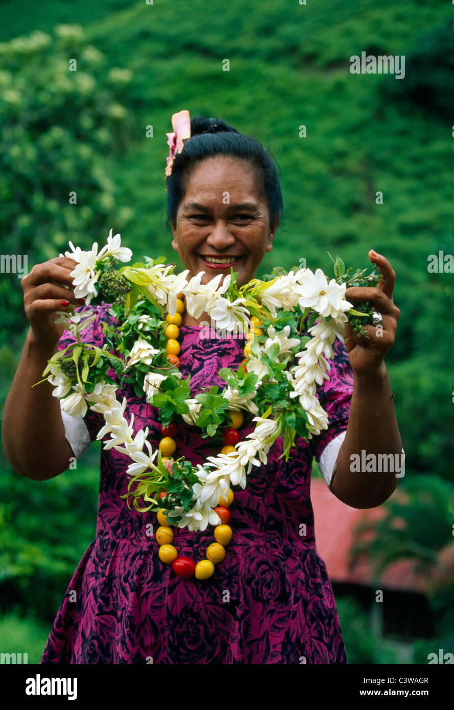 NATIVE WOMAN HOLDING A LEI / MARQUESAS ISLANDS Stock Photo