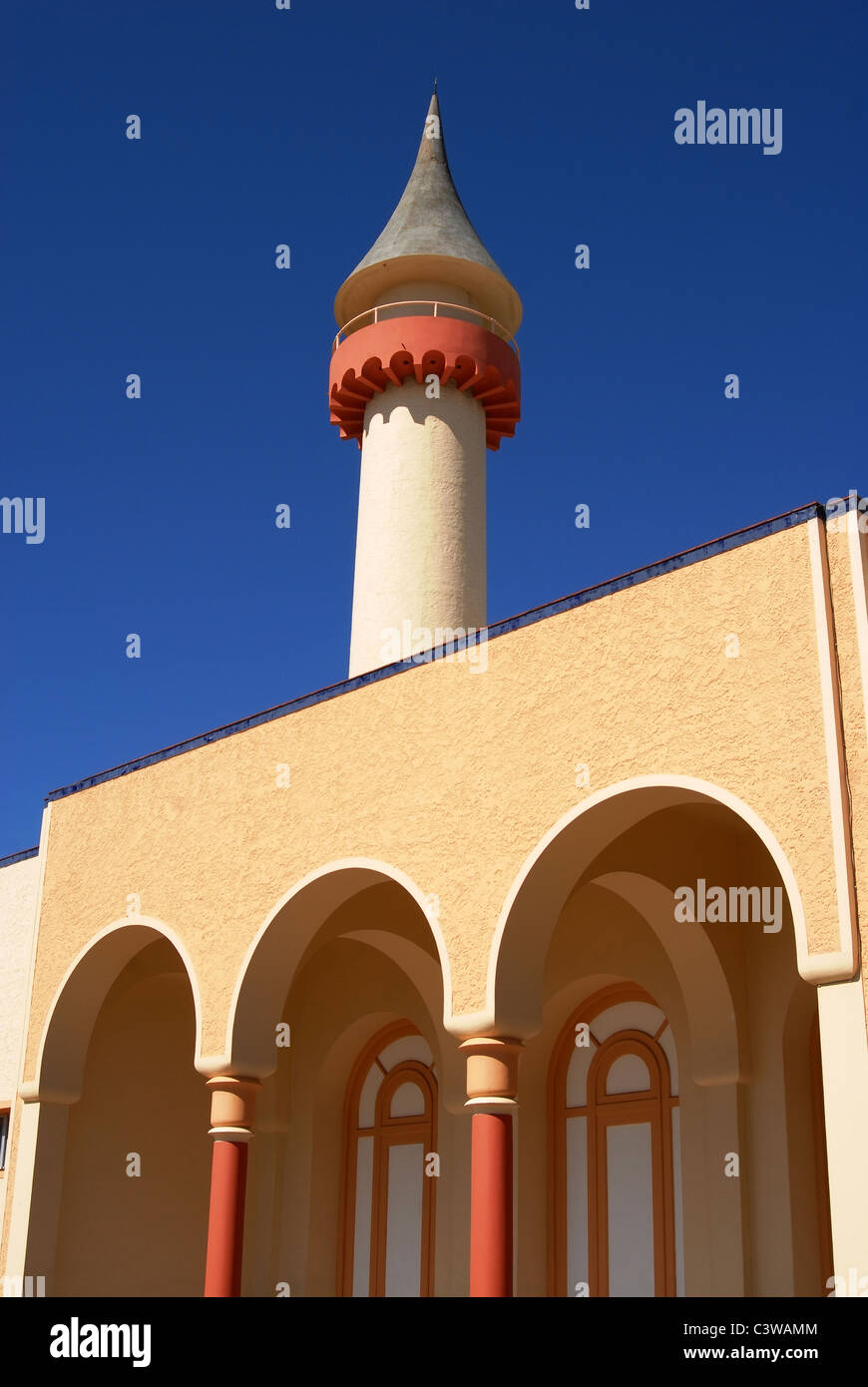 Landmark building detail. Tower and arcades on blue sky background Stock Photo