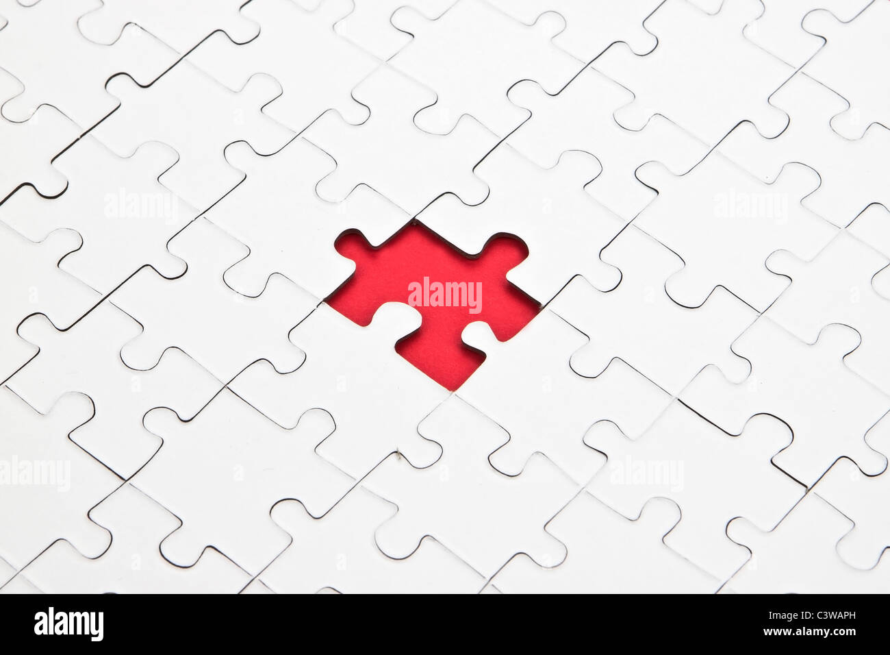 a puzzle with missing parts, which are connected Stock Photo