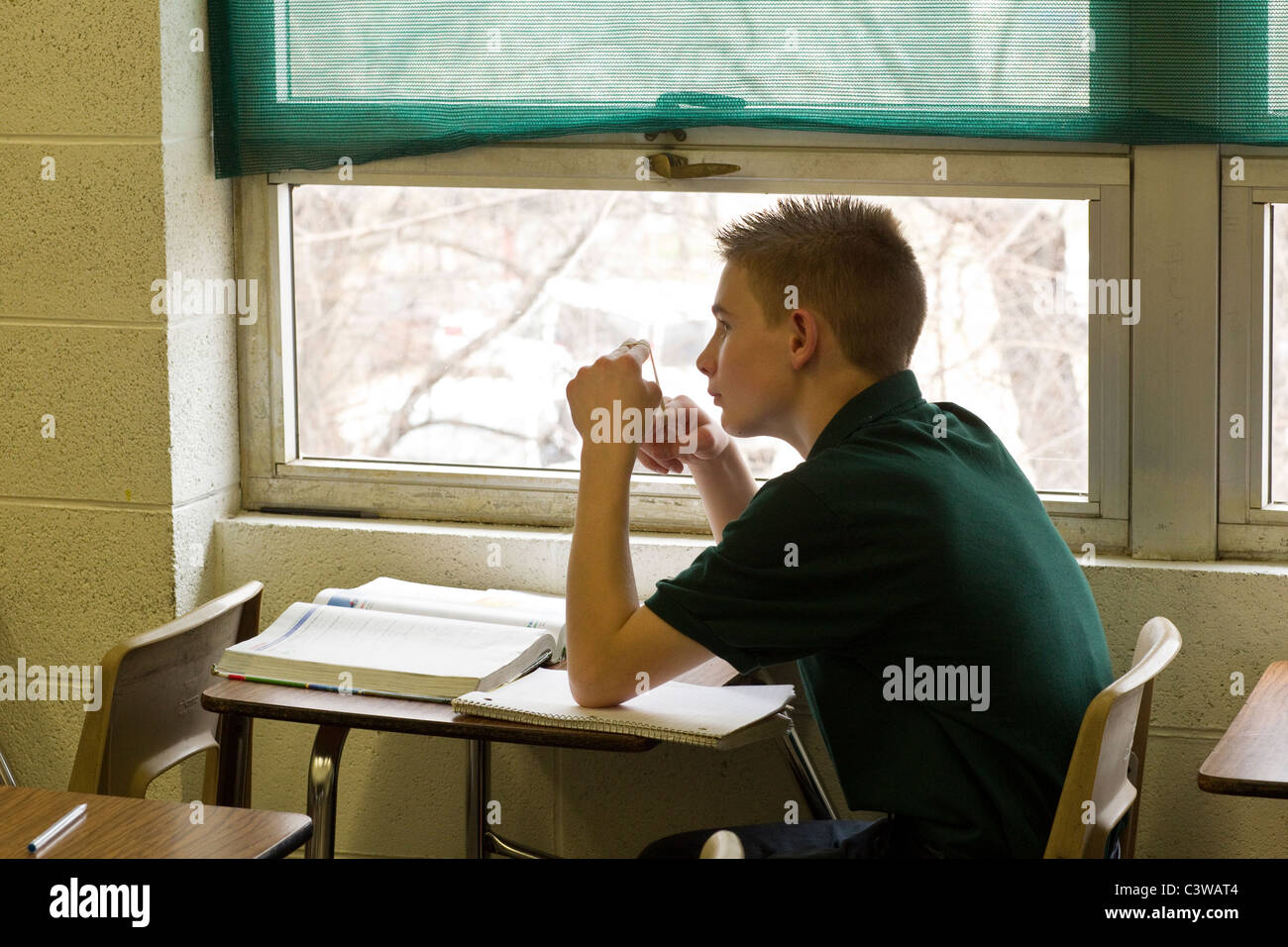 Anglo male student listens to his teacher talk during class at Rapoport