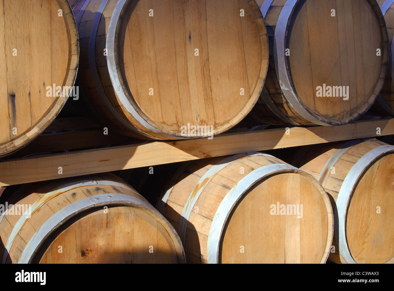 Barrels of wine in storage. Stock Photo