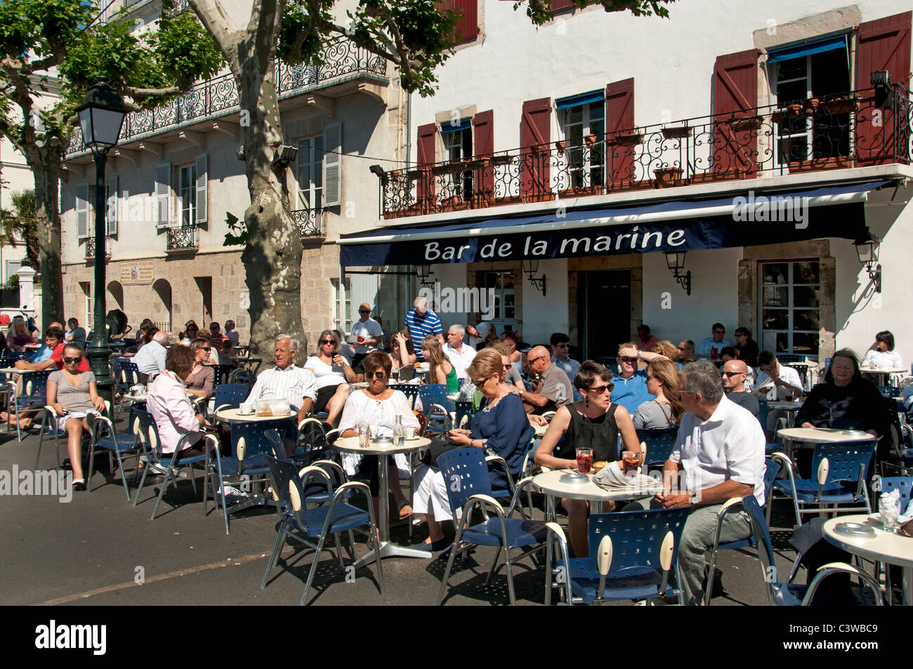 Place Loui XIV France St Jean de Luz Restaurant Bar Pub Pavement a typical fishing village Stock Photo